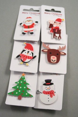 Clip Strip of 12 Plastic Christmas Character Pin Badges. In Santa, Elf, Reindeer, Christmastree, Snowman and Penguin Designs