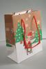Christmas Scene Elf on a Reindeer Gift Bag with Red Cord Handles. Approx Size 15cm x 12cm x 6cm - view 1