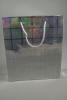Silver Snowflake Christmas Print Holographic Gift Bag with Grey Cord Handles. Approx Size 27cm x 23cm x 8cm - view 2